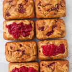 Some breads topped with extra peanut butter and mashed raspberries.