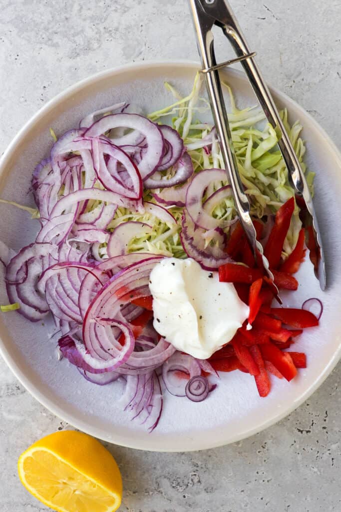 The slaw ingredients in a bowl.