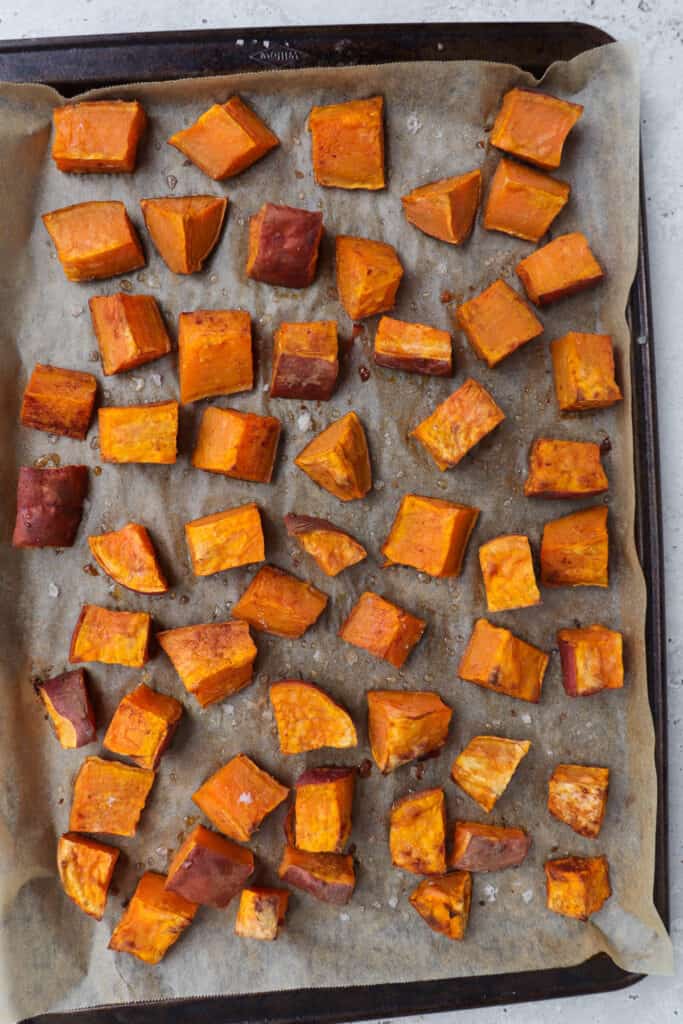 Roasted sweet potato on baking tray.