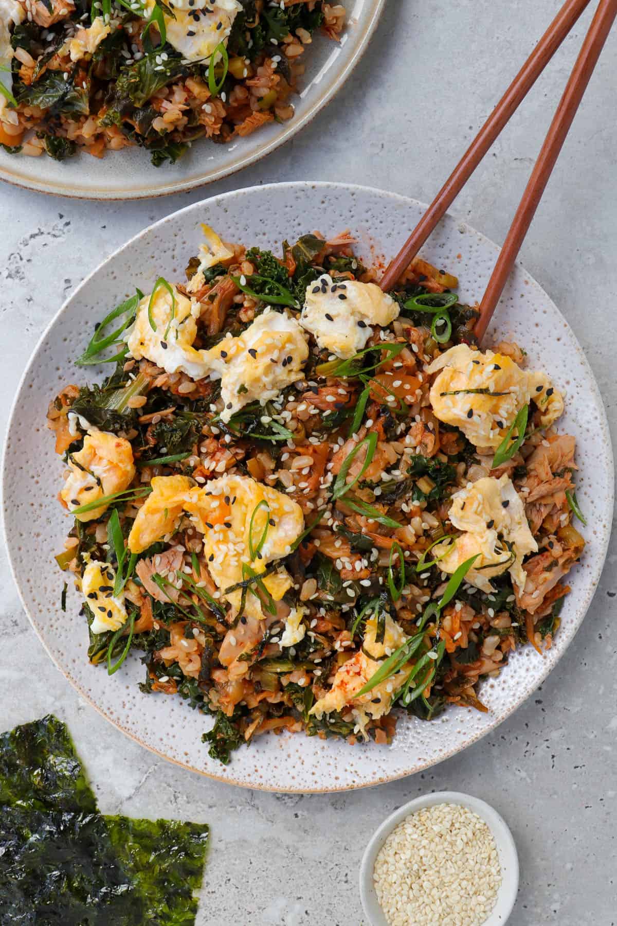 Kimchi fried rice on plate with chop sticks.