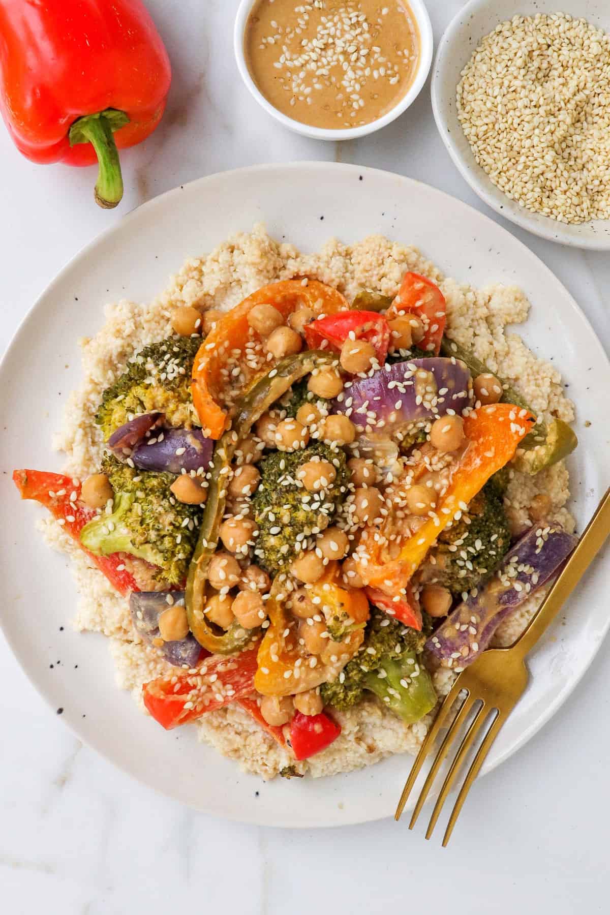 Baked chickpeas and veggies ion a plate.