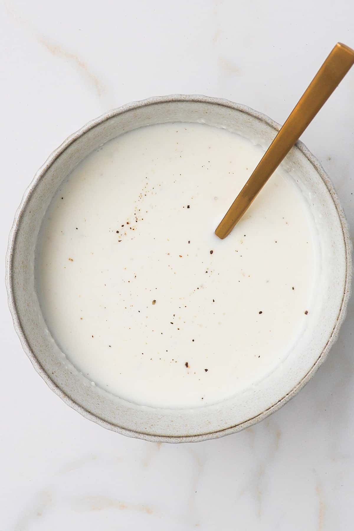 Feta yoghurt dressing in a bowl.