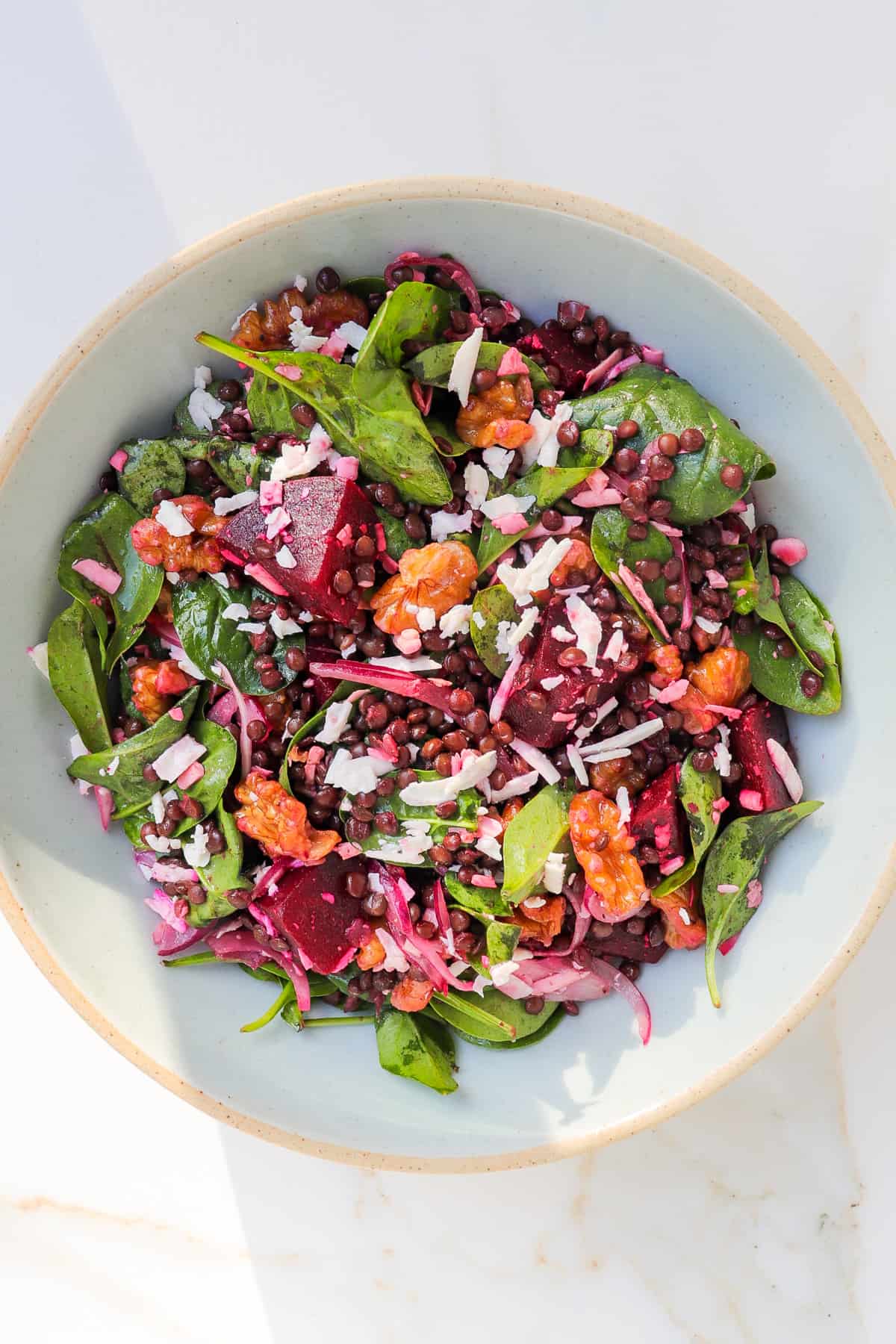 Beetroot salad served in a bow with the sunlight beaming on it.