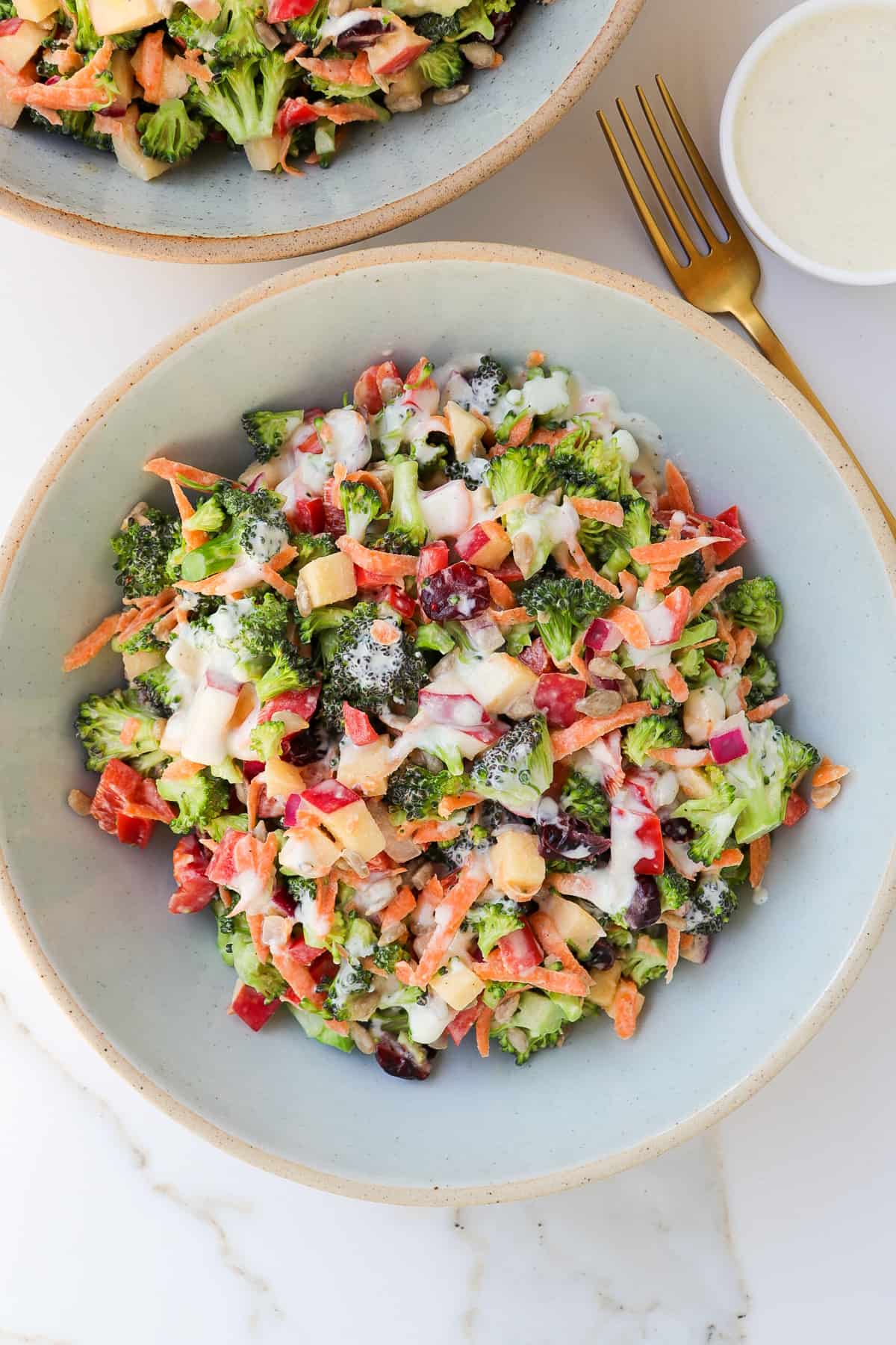 Creamy raw broccoli salad in a bowl.