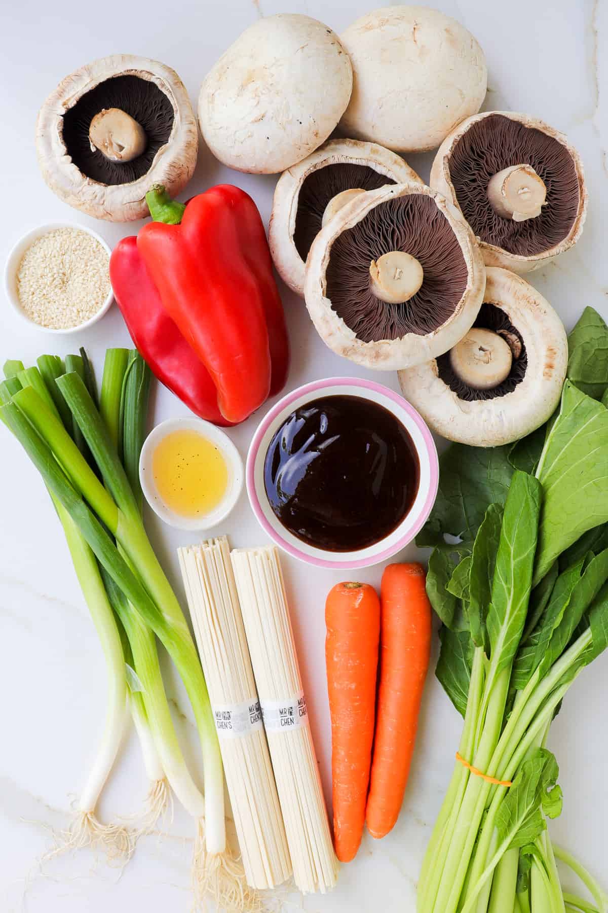 Ingredients shown to make vegetable teriyaki udon noodles.