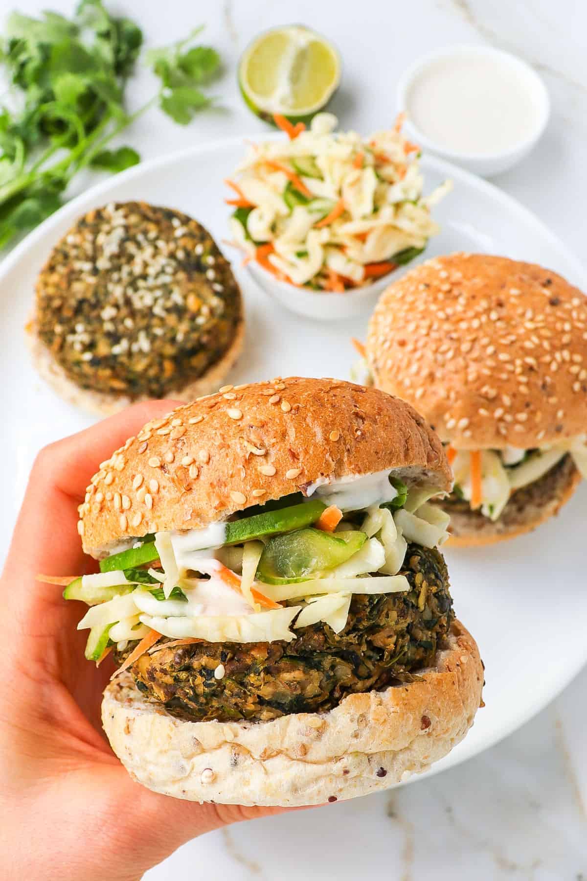 Close up shot of mung bean burger in hand.