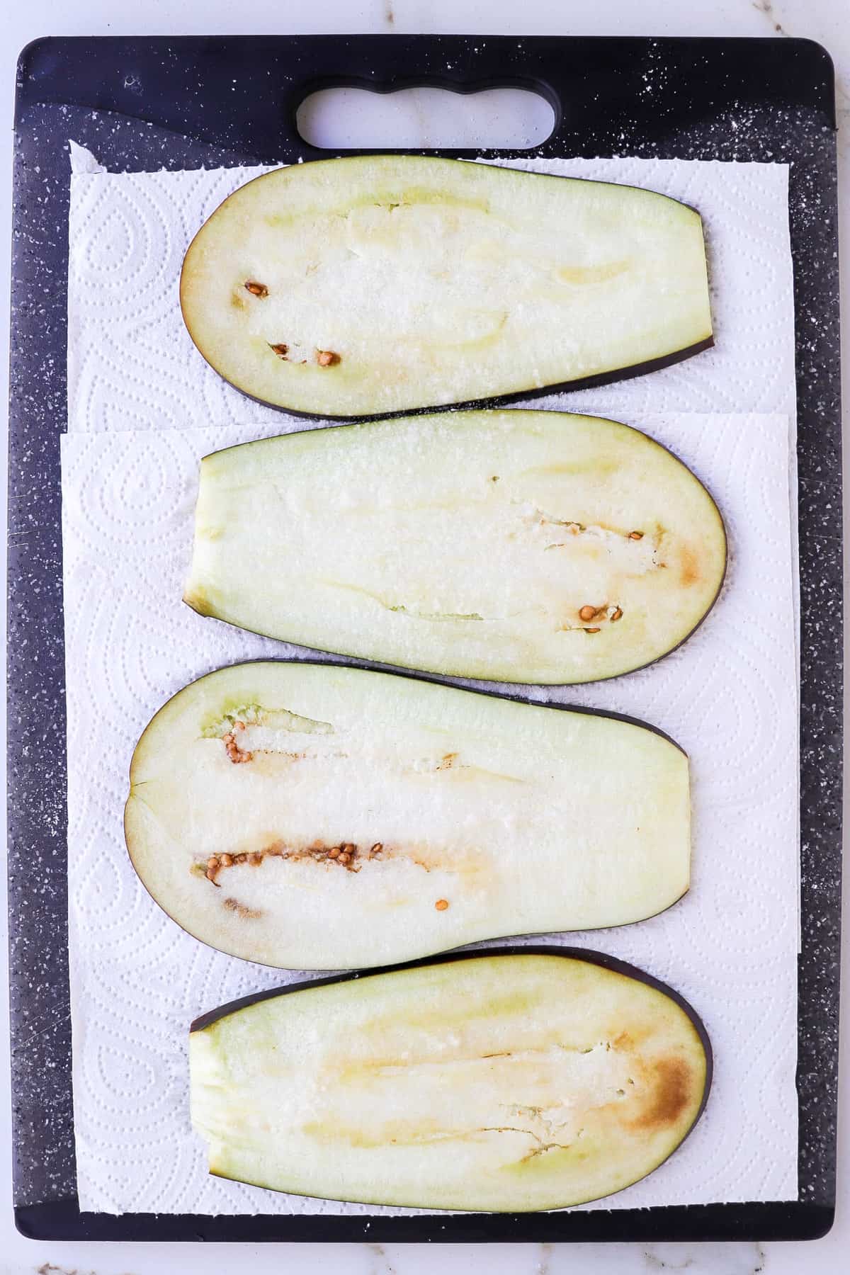 Eggplant slices on paper towel.
