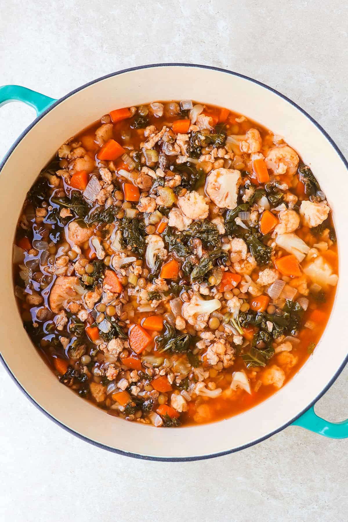 Turkey lentil soup in a large pot.