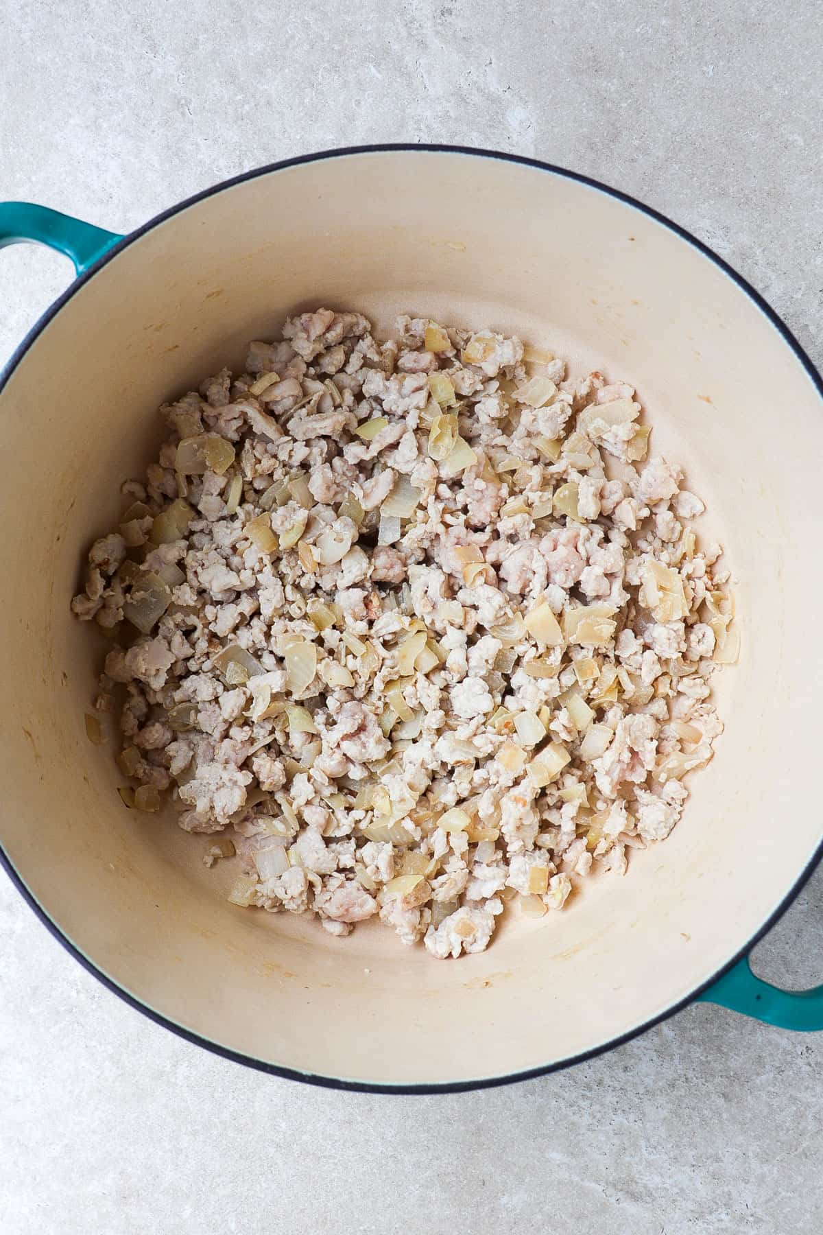 Cooked ground turkey in a large pot.