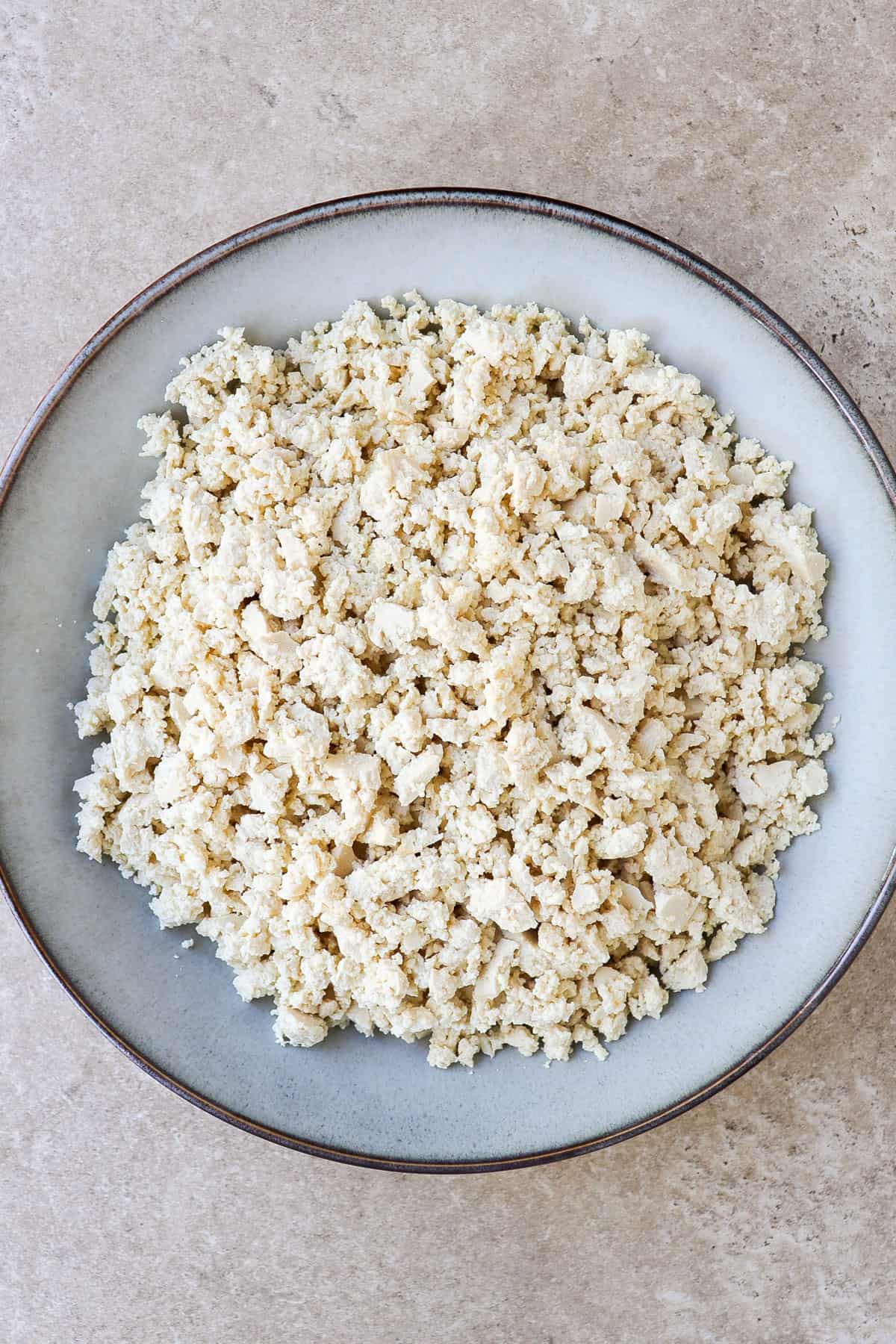 Crumbled tofu in a bowl.