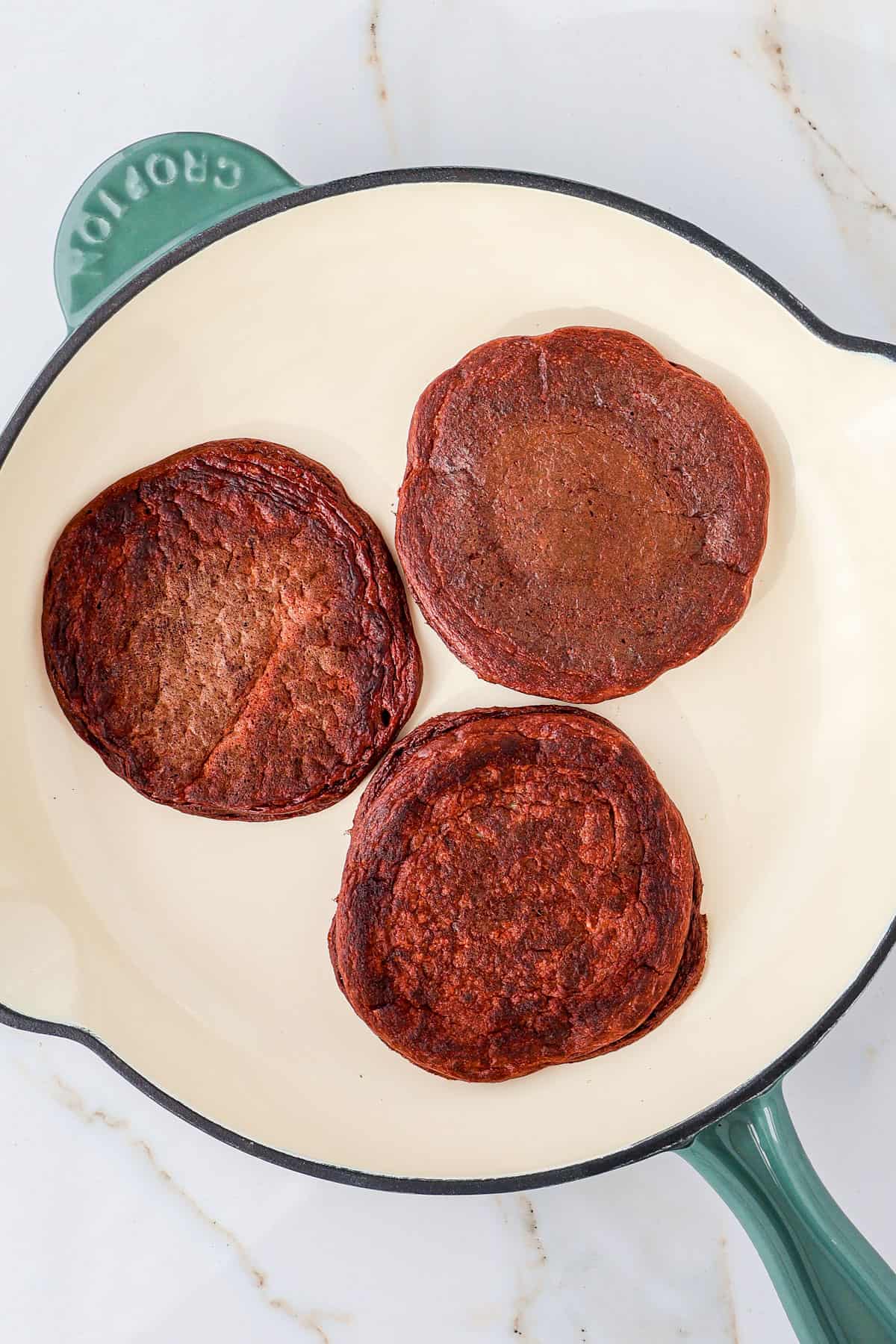 Protein pancakes in a skillet.