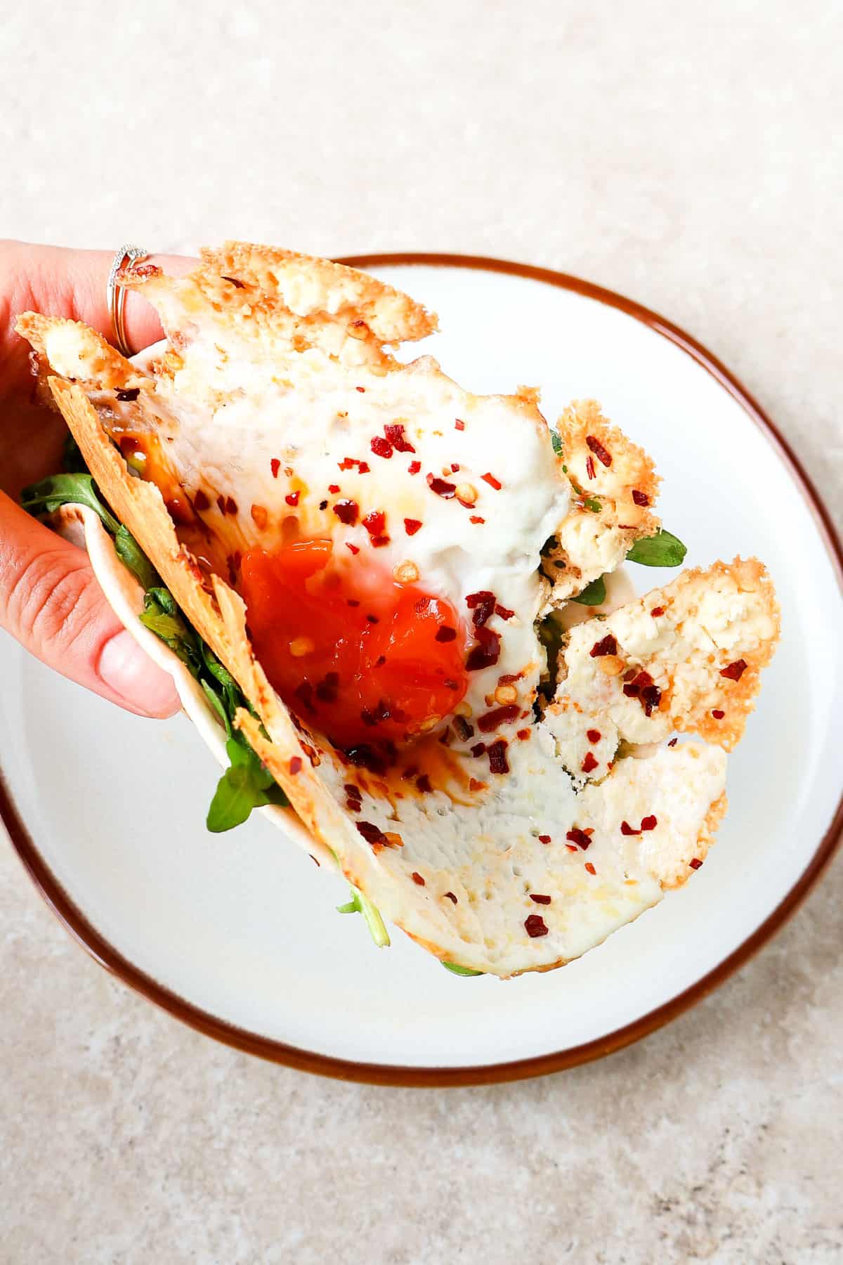 Crispy feta egg taco in hand.