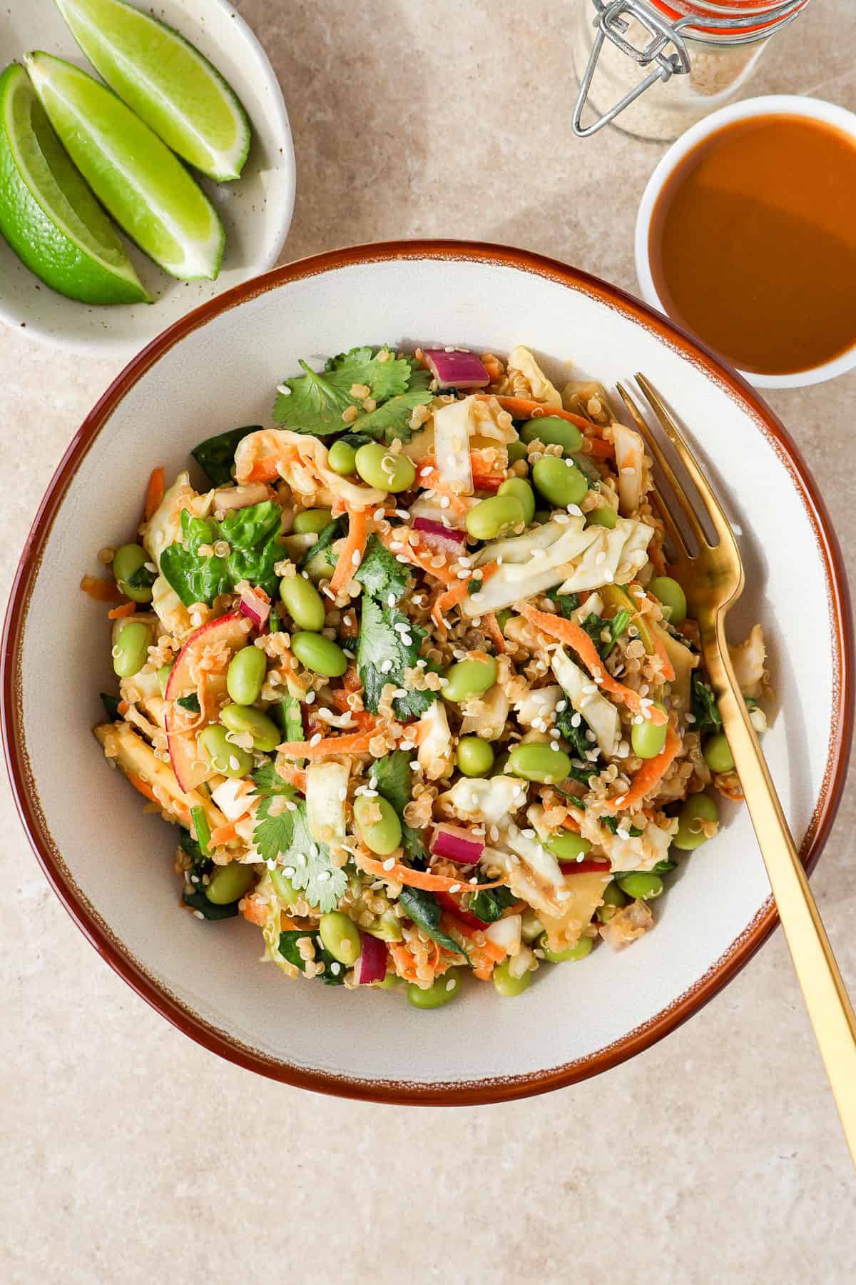 Edamame salad in a bowl with a fork.