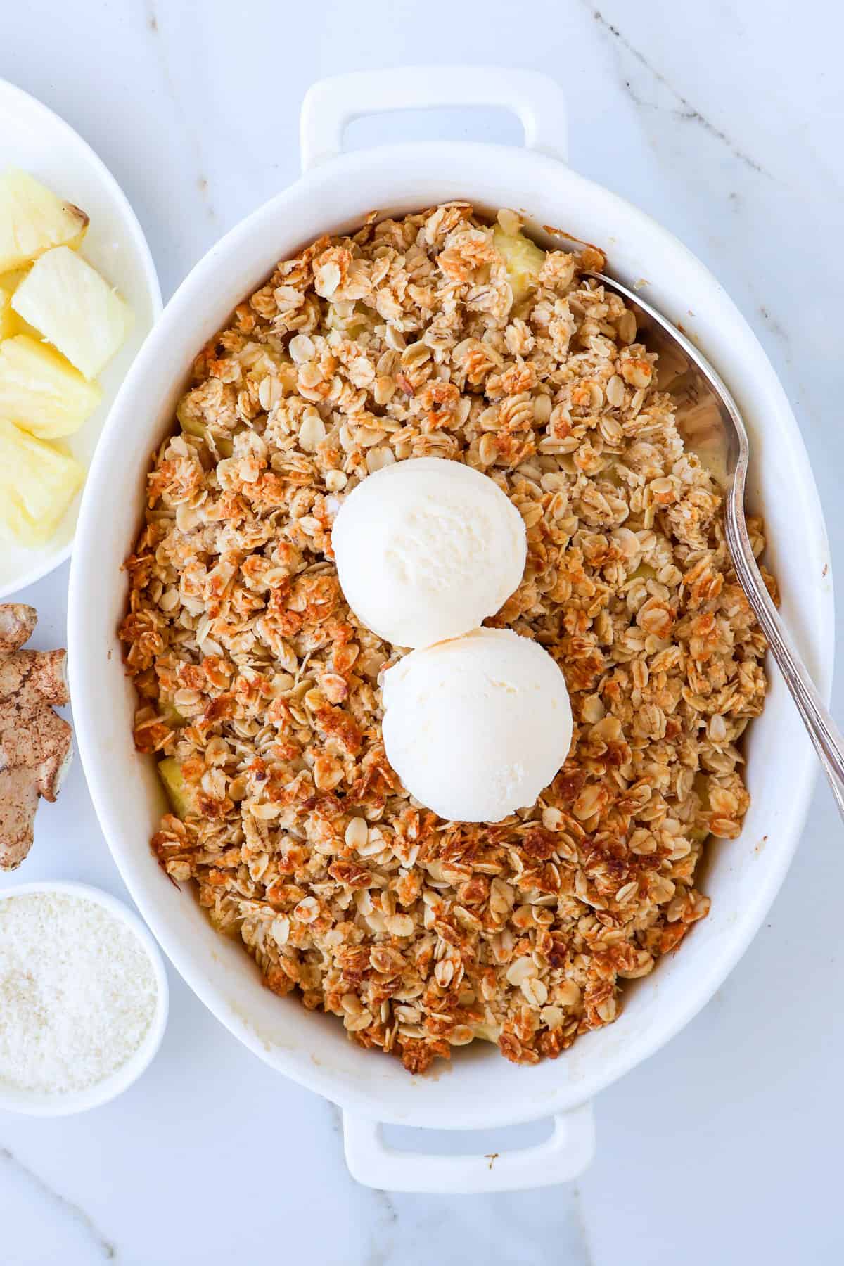 Pineapple crisp topped with ice cream.