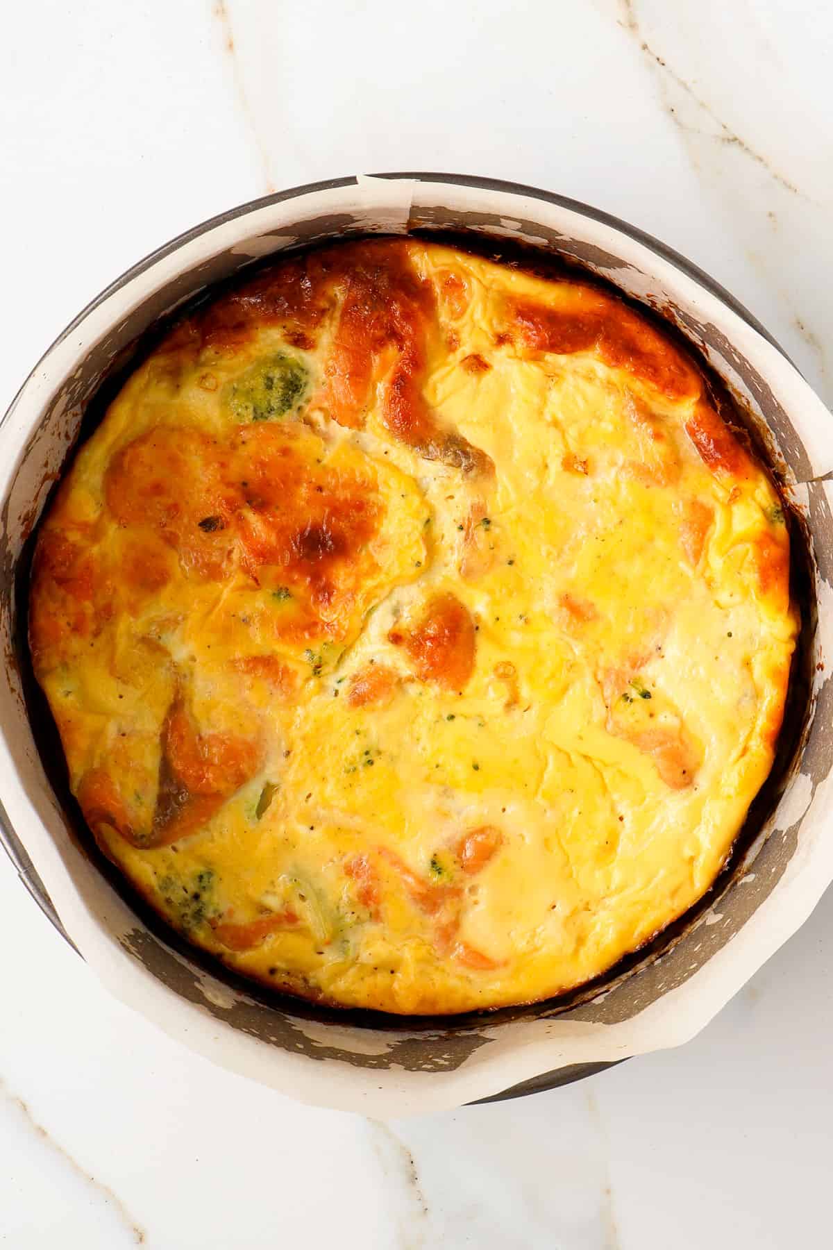 Salmon and broccoli quiche in the springform pan.