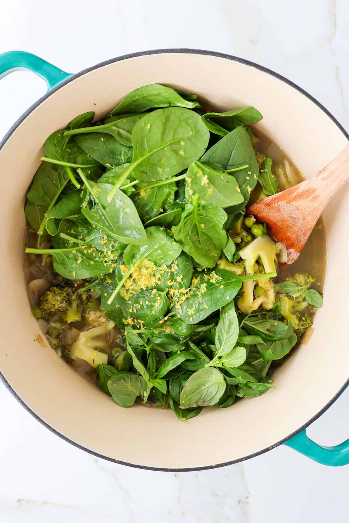 Spinach and lemon zest added to the pot.