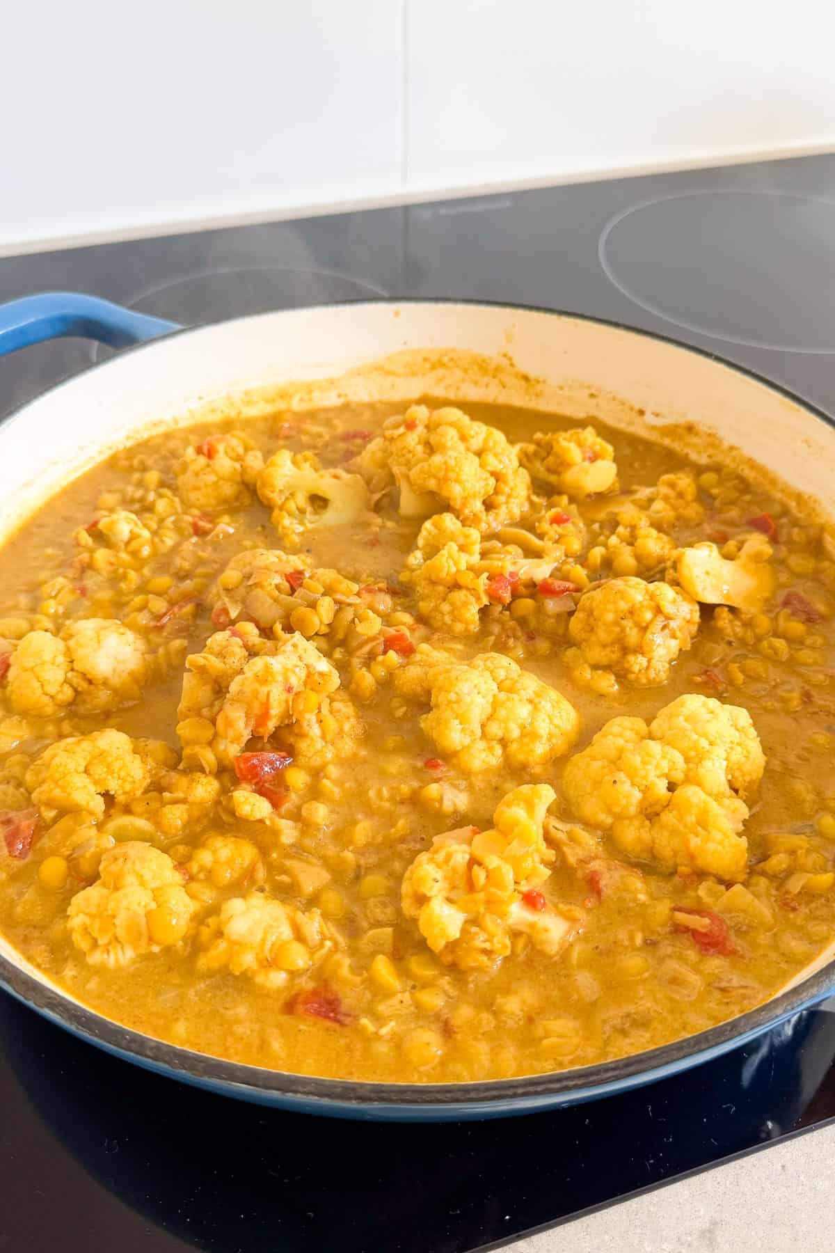 Cauliflower added to pot.
