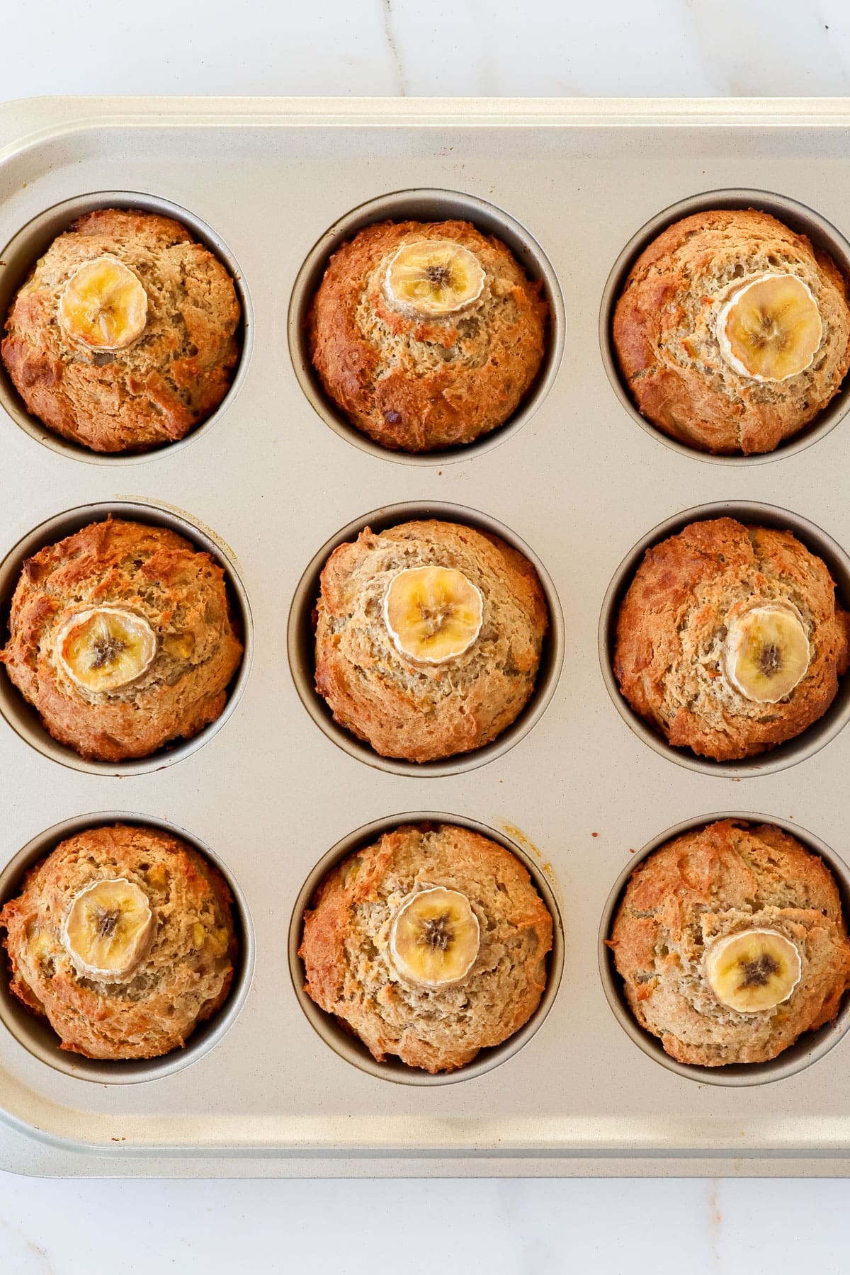 Baked muffins in pan.